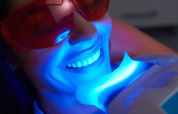 Dental patient receiving teeth whitening treatment