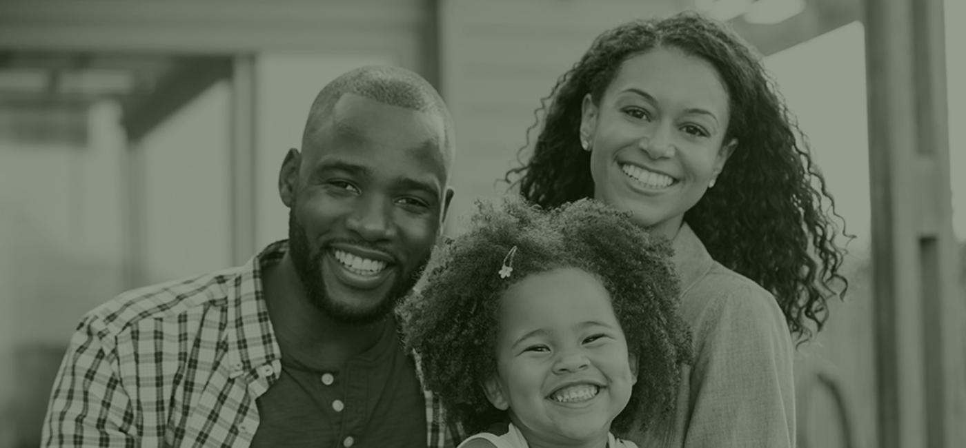 family of 3 smiling together